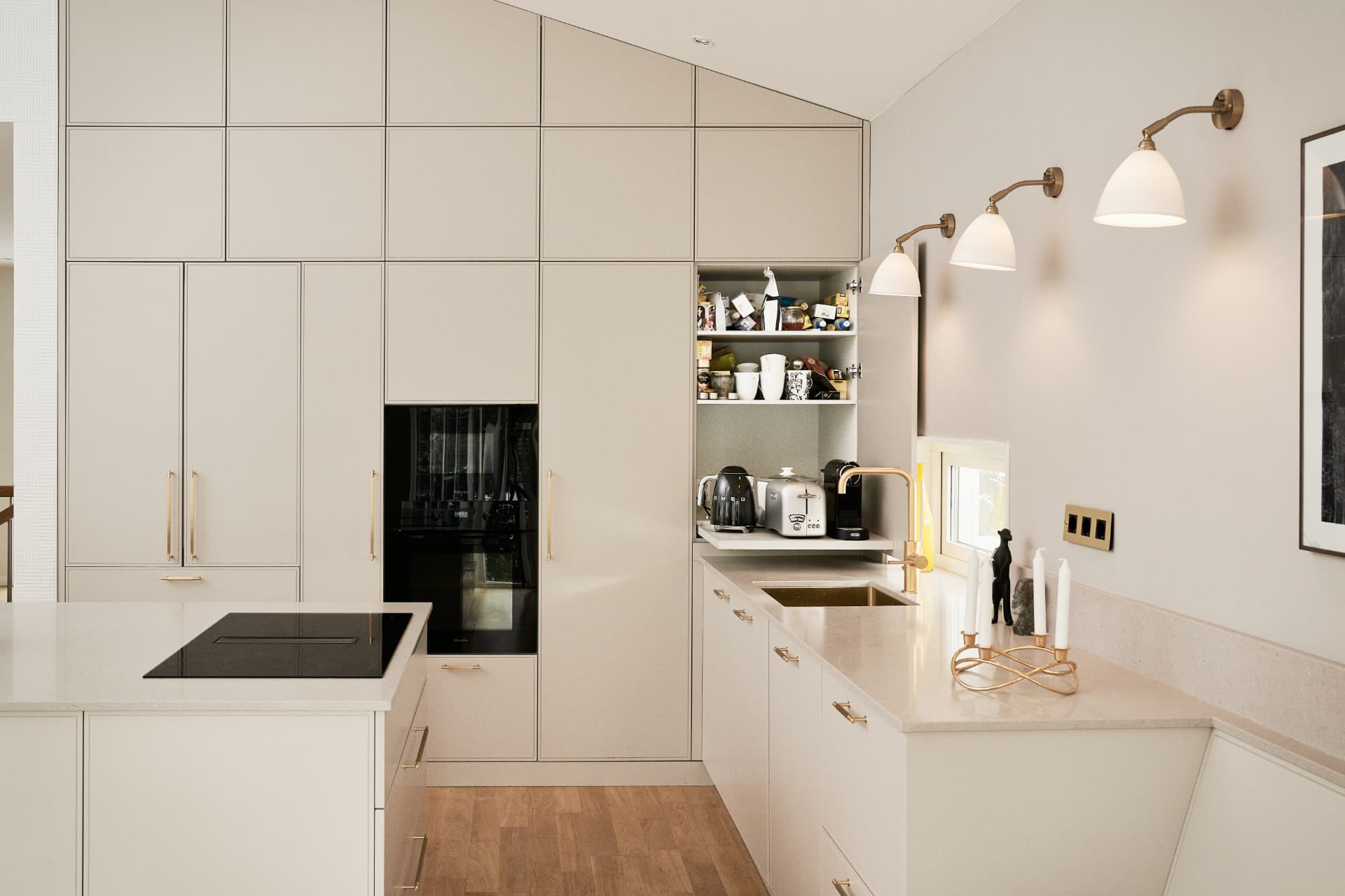 Black kitchen appliances integrated into the kitchen furniture